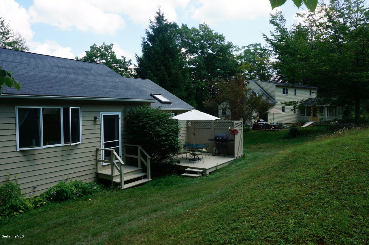 4 Stonebridge Way Tyringham, MA 01264 - Photo 33 of 40 a view of a house with backyard