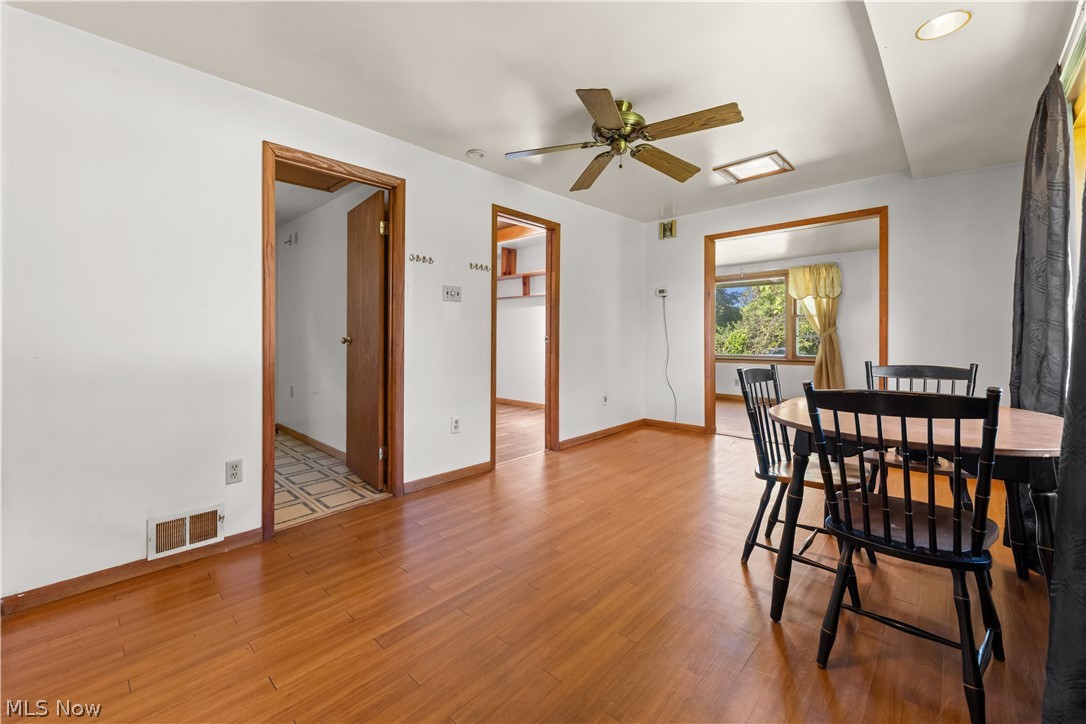 409 Edith Avenue Akron, OH 44312 - Photo 15 of 45 Open concept room featuring wood-finish flooring, white walls, and wood trim throughout