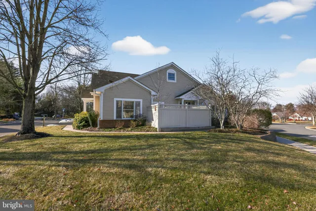 a living room with furniture and a mirror