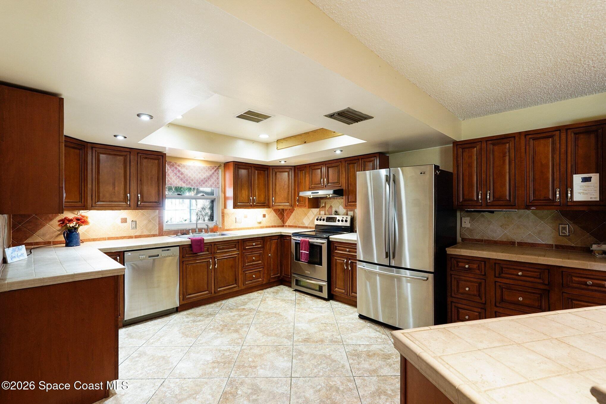 1351 Cherry Hills Road Northeast Palm Bay, FL 32905 - Photo 2 of 15 Large Kitchen
