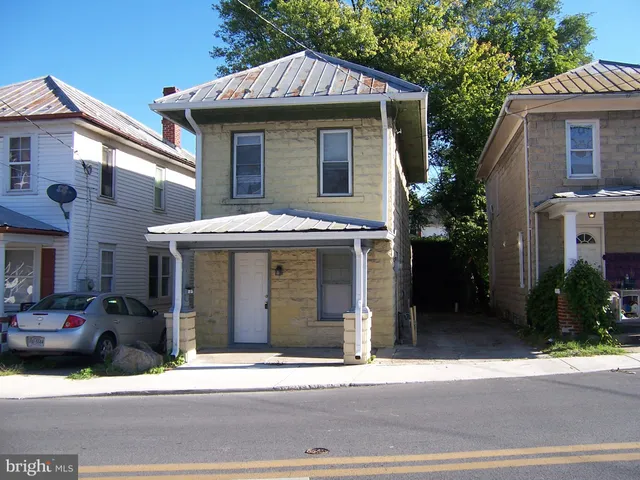 a view of a house with a street
