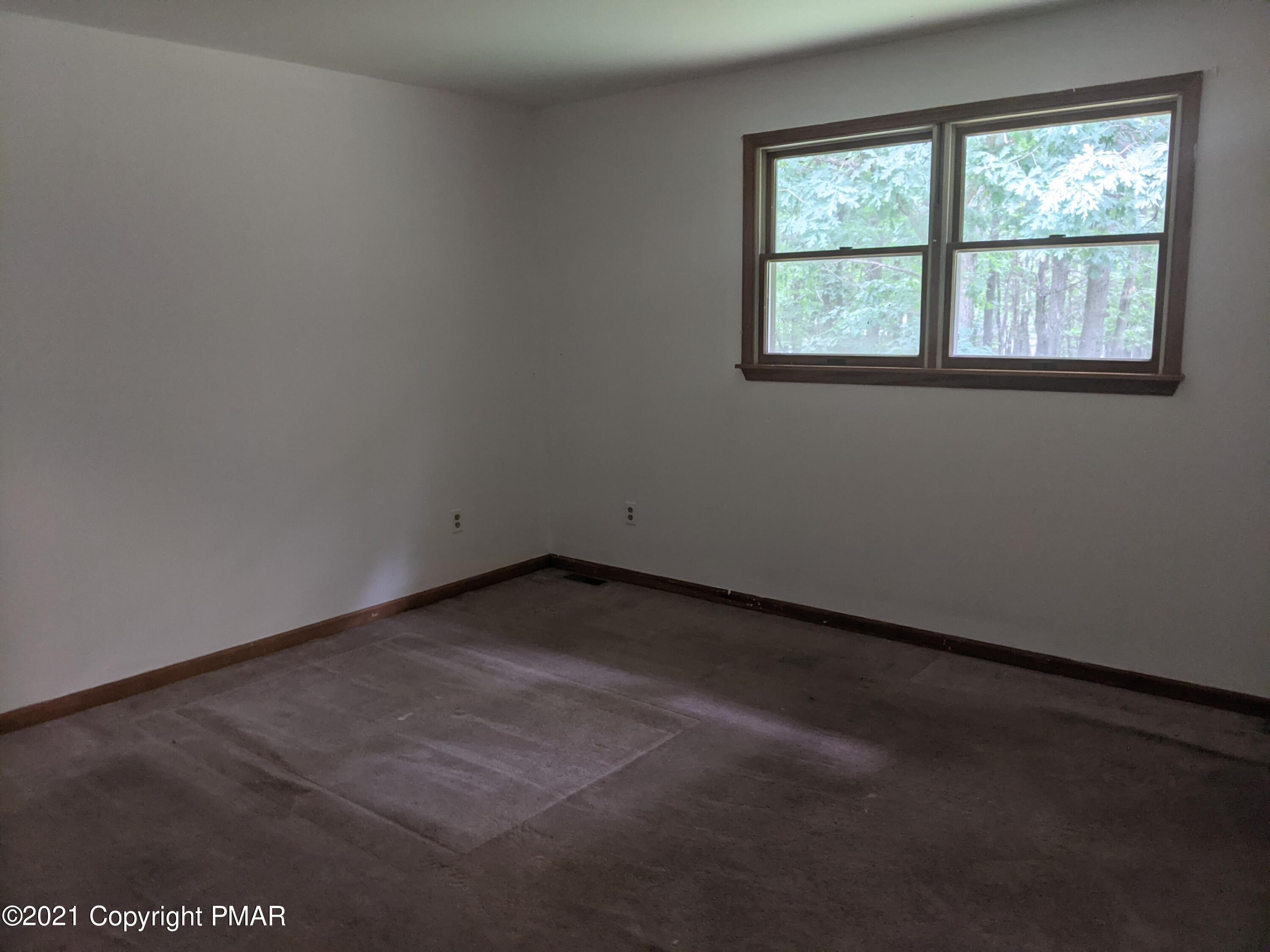 180 Shenkel Road Effort, PA 18330 - Photo 13 of 24 an empty room with a window