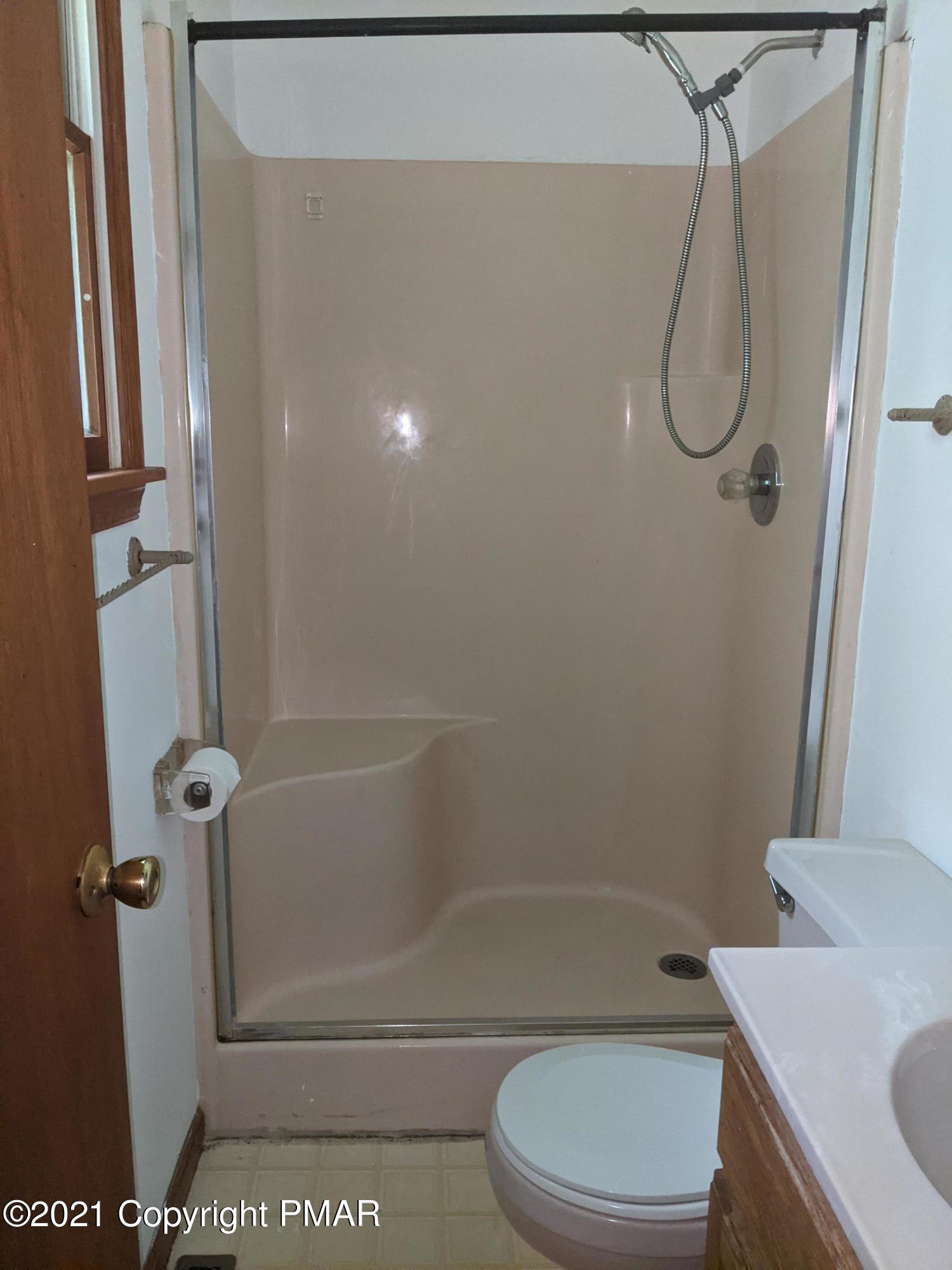180 Shenkel Road Effort, PA 18330 - Photo 14 of 24 a bathroom with a toilet and shower