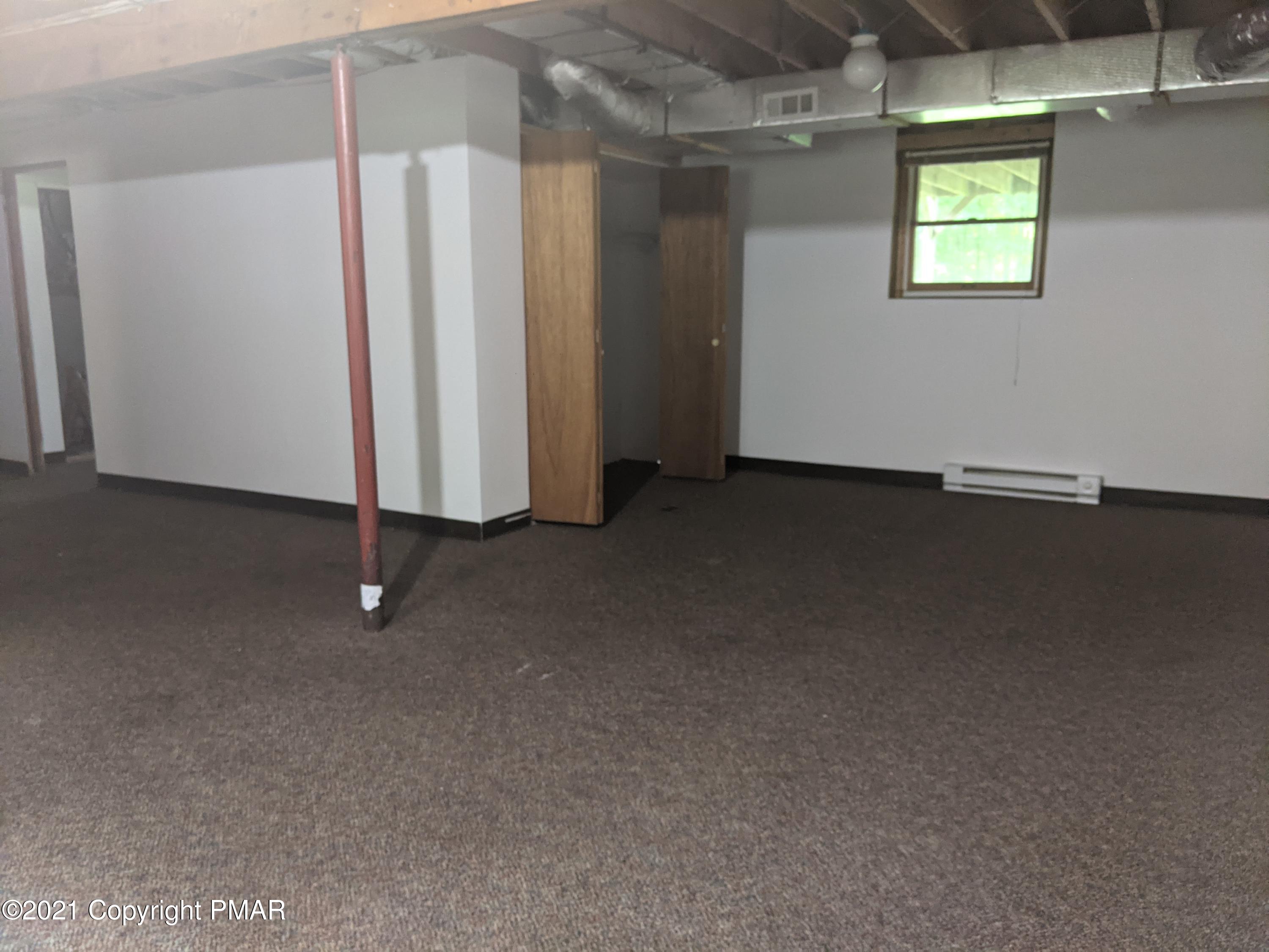 180 Shenkel Road Effort, PA 18330 - Photo 16 of 24 an empty room with windows