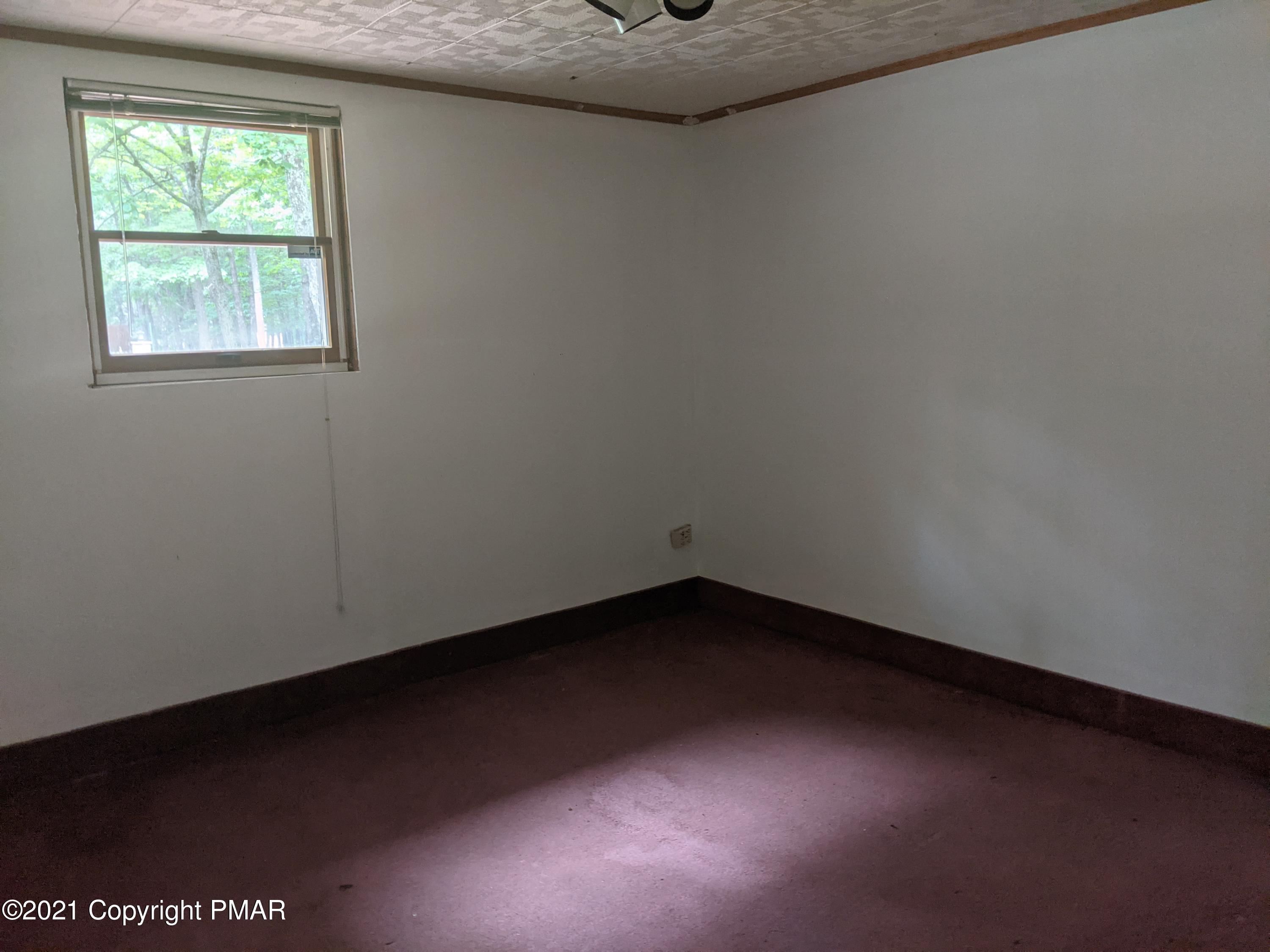 180 Shenkel Road Effort, PA 18330 - Photo 18 of 24 an empty room with a window