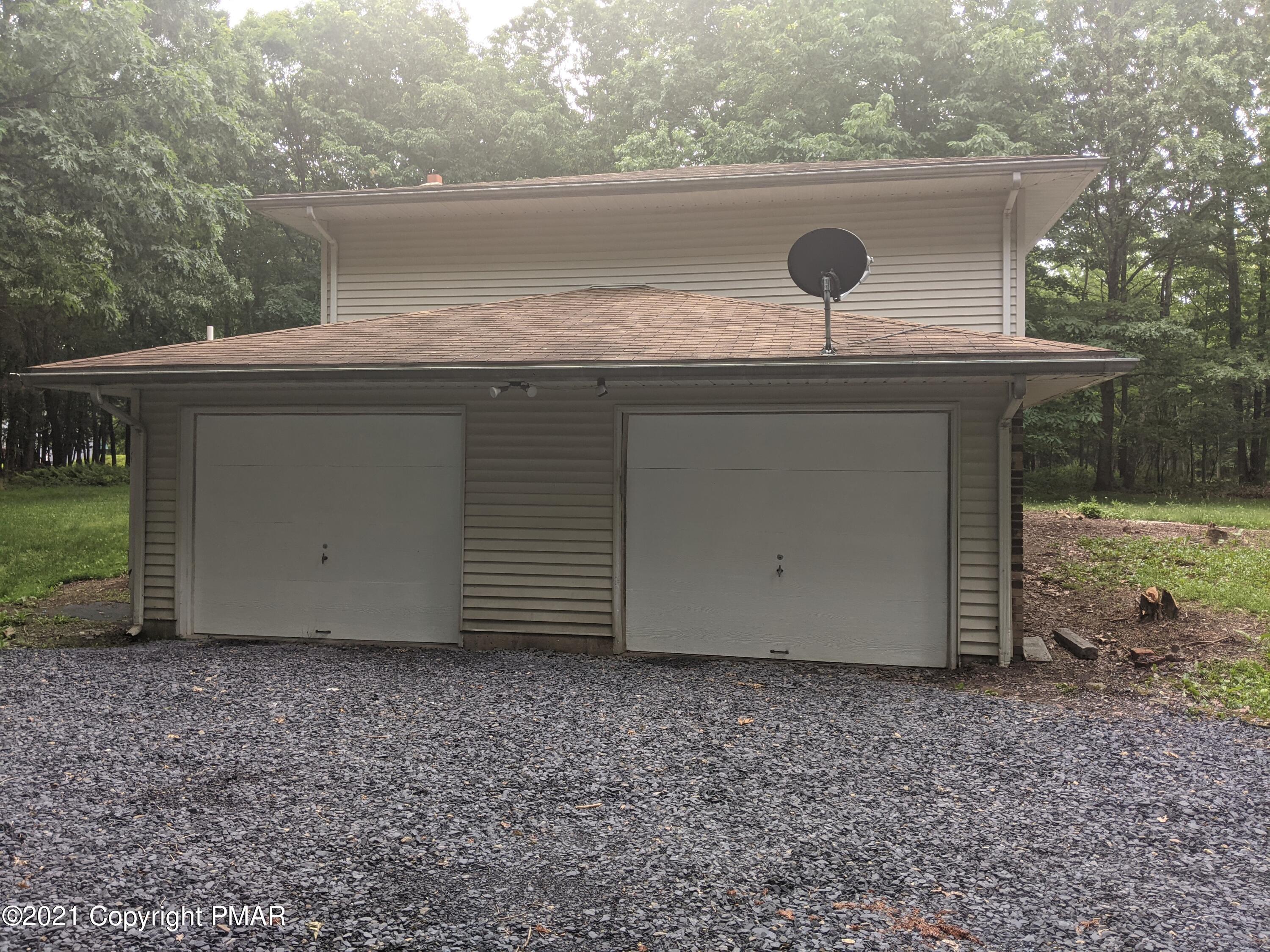 180 Shenkel Road Effort, PA 18330 - Photo 21 of 24 a front view of a house with garden