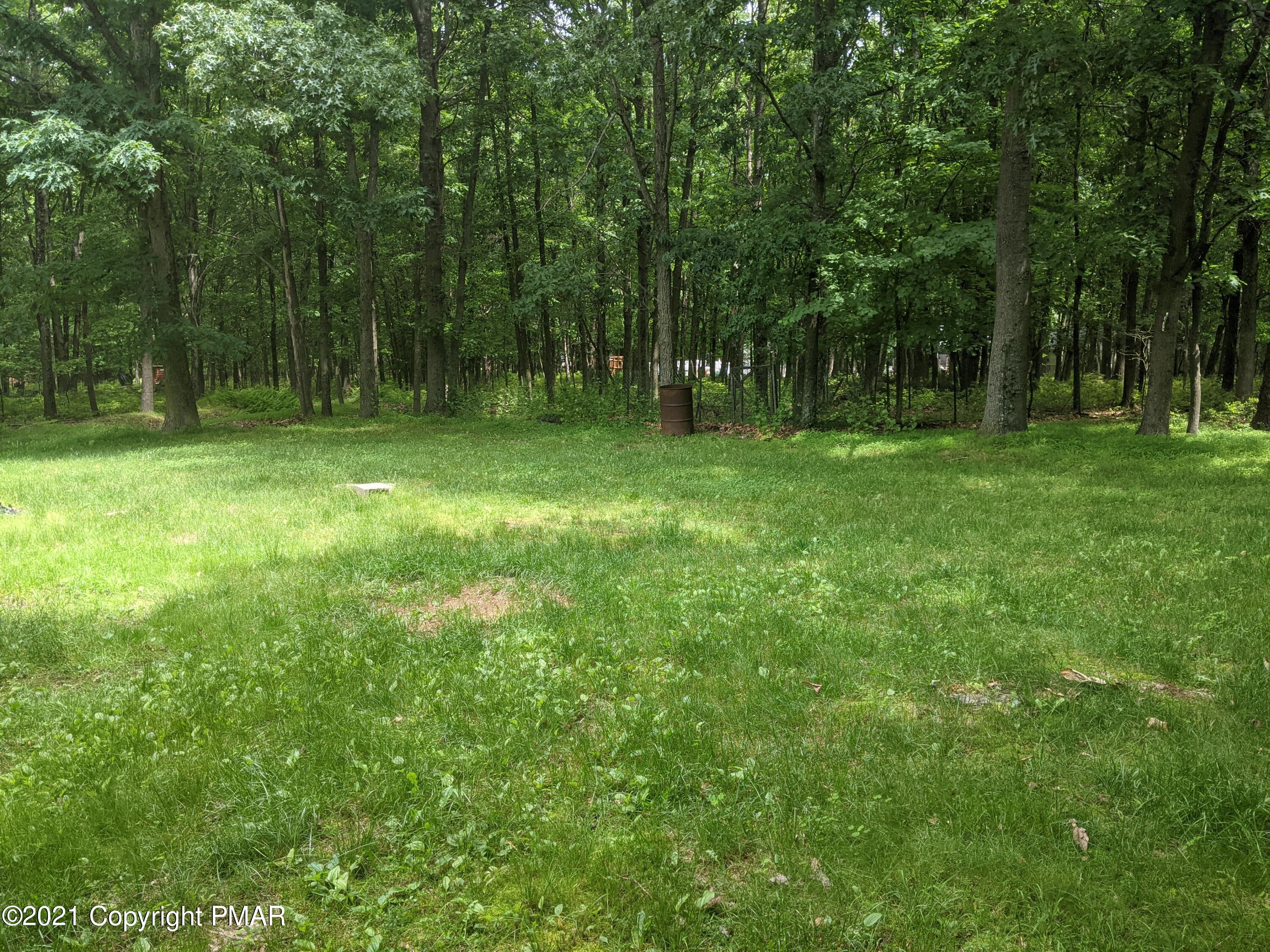 180 Shenkel Road Effort, PA 18330 - Photo 22 of 24 a backyard of a house with lots of green space