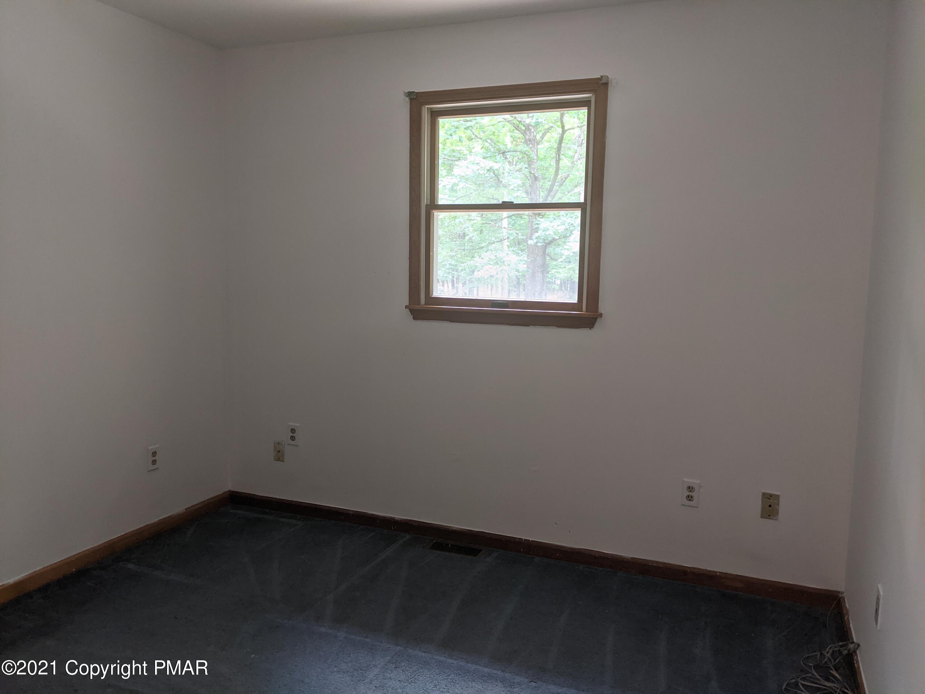180 Shenkel Road Effort, PA 18330 - Photo 8 of 24 an empty room with a window