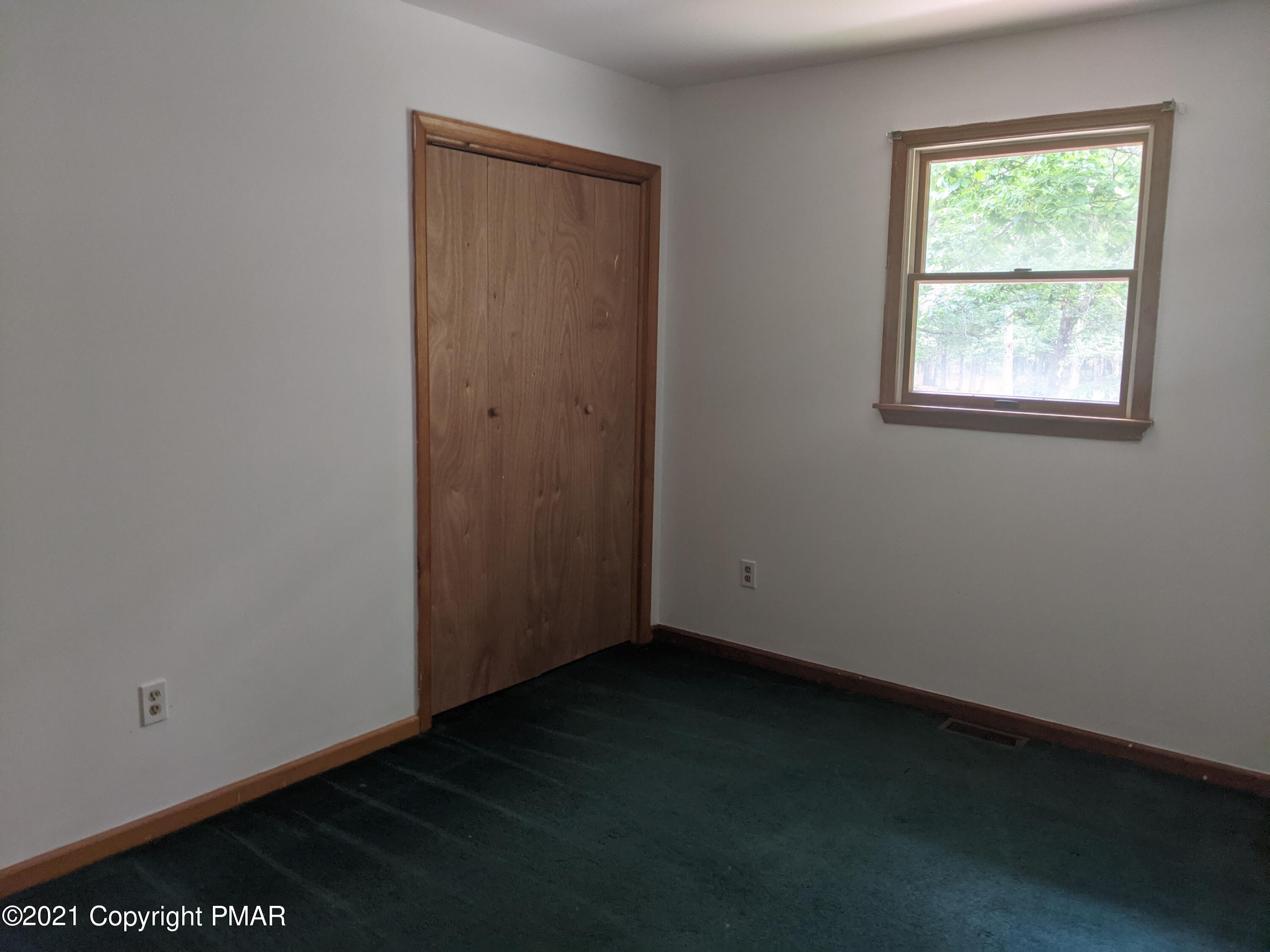 180 Shenkel Road Effort, PA 18330 - Photo 9 of 24 an empty room with a window