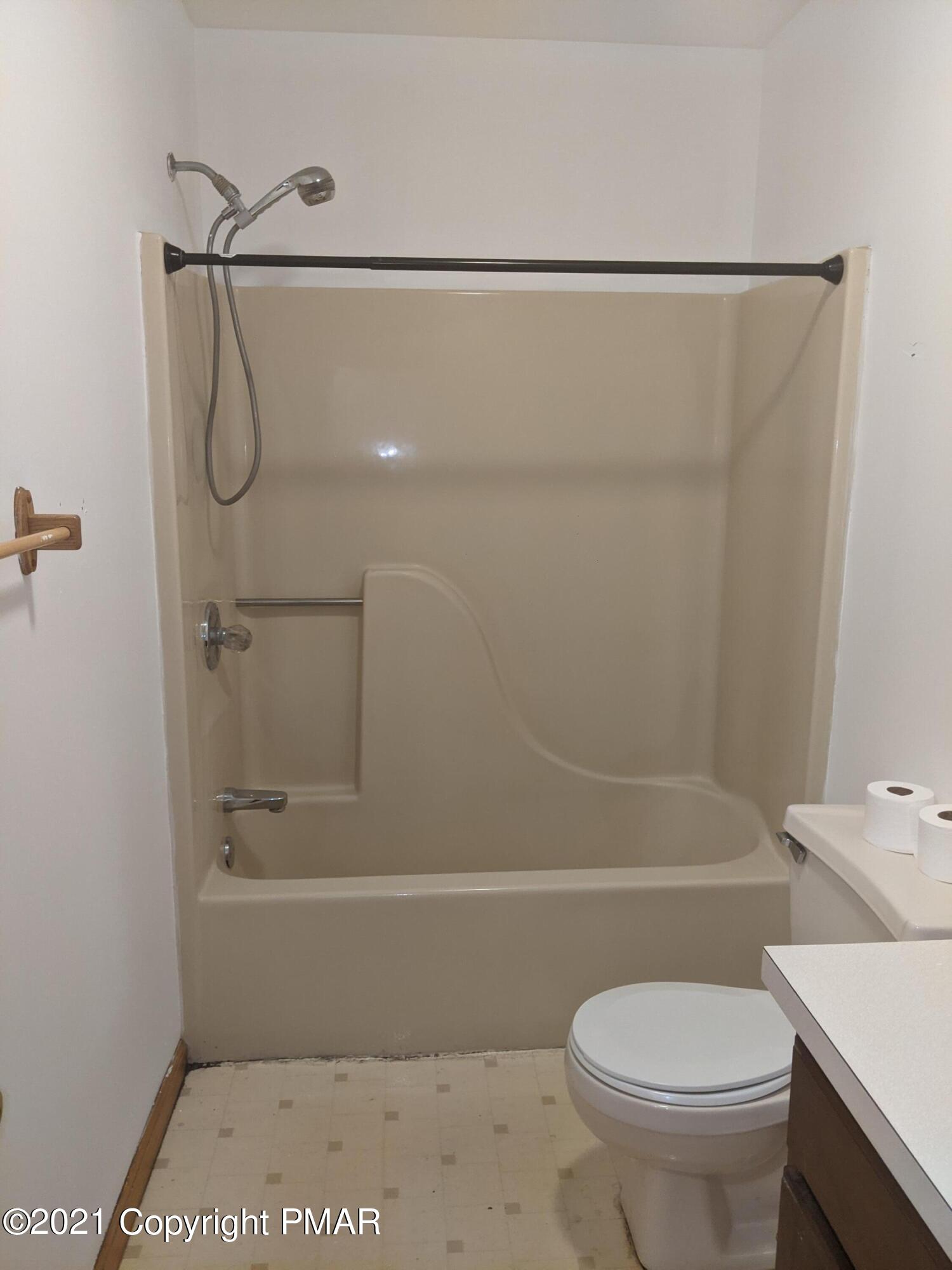 180 Shenkel Road Effort, PA 18330 - Photo 10 of 24 a bathroom with a shower a toilet and a shower