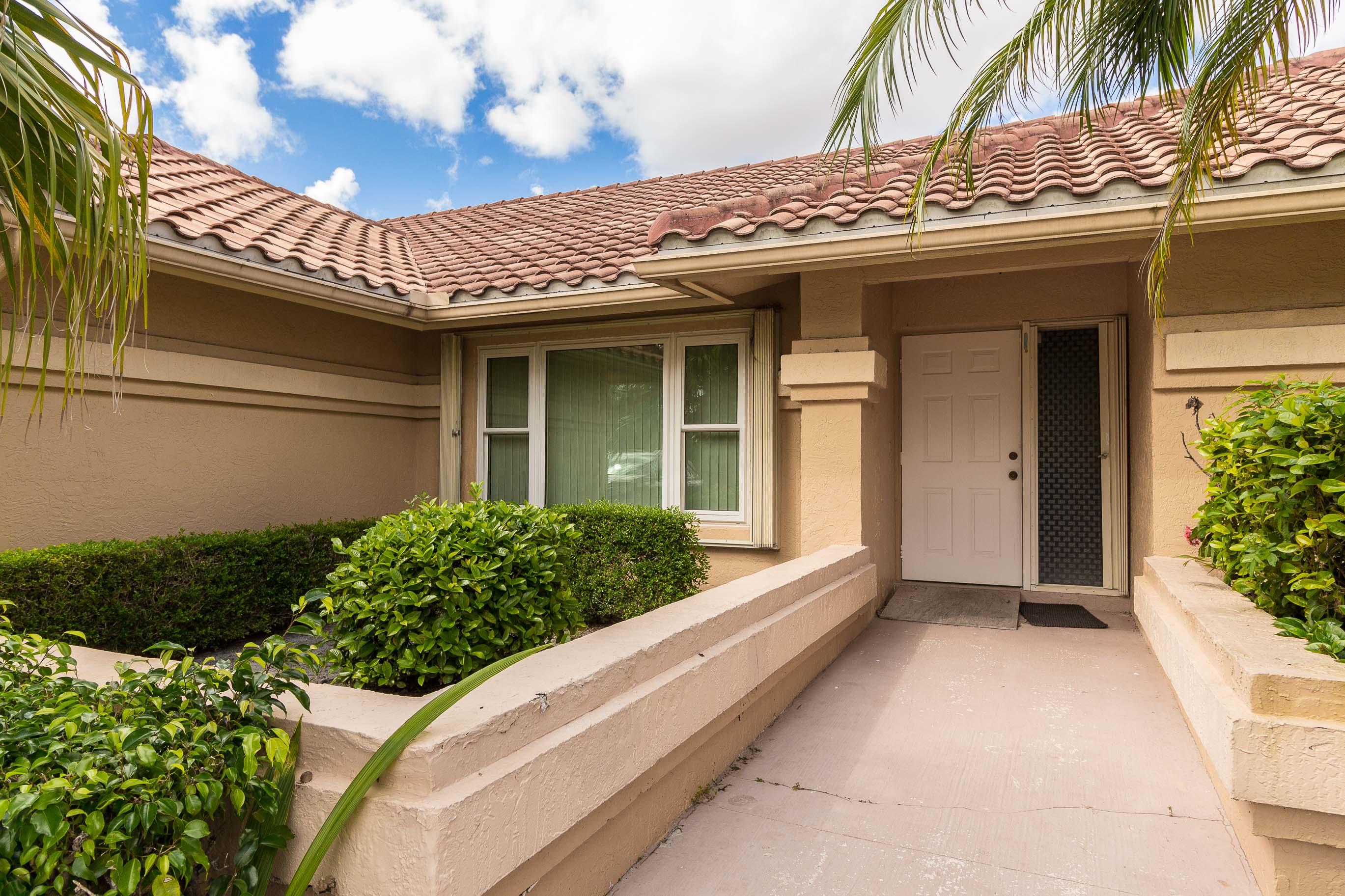9580 El Clair Ranch Road Boynton Beach, FL 33437 - Photo 2 of 26 Garden Entry