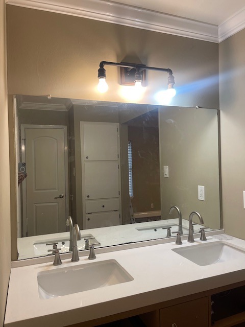 1002 Creekbend Cove Pflugerville, TX 78660 - Photo 15 of 16 Full bathroom featuring crown molding and double vanity