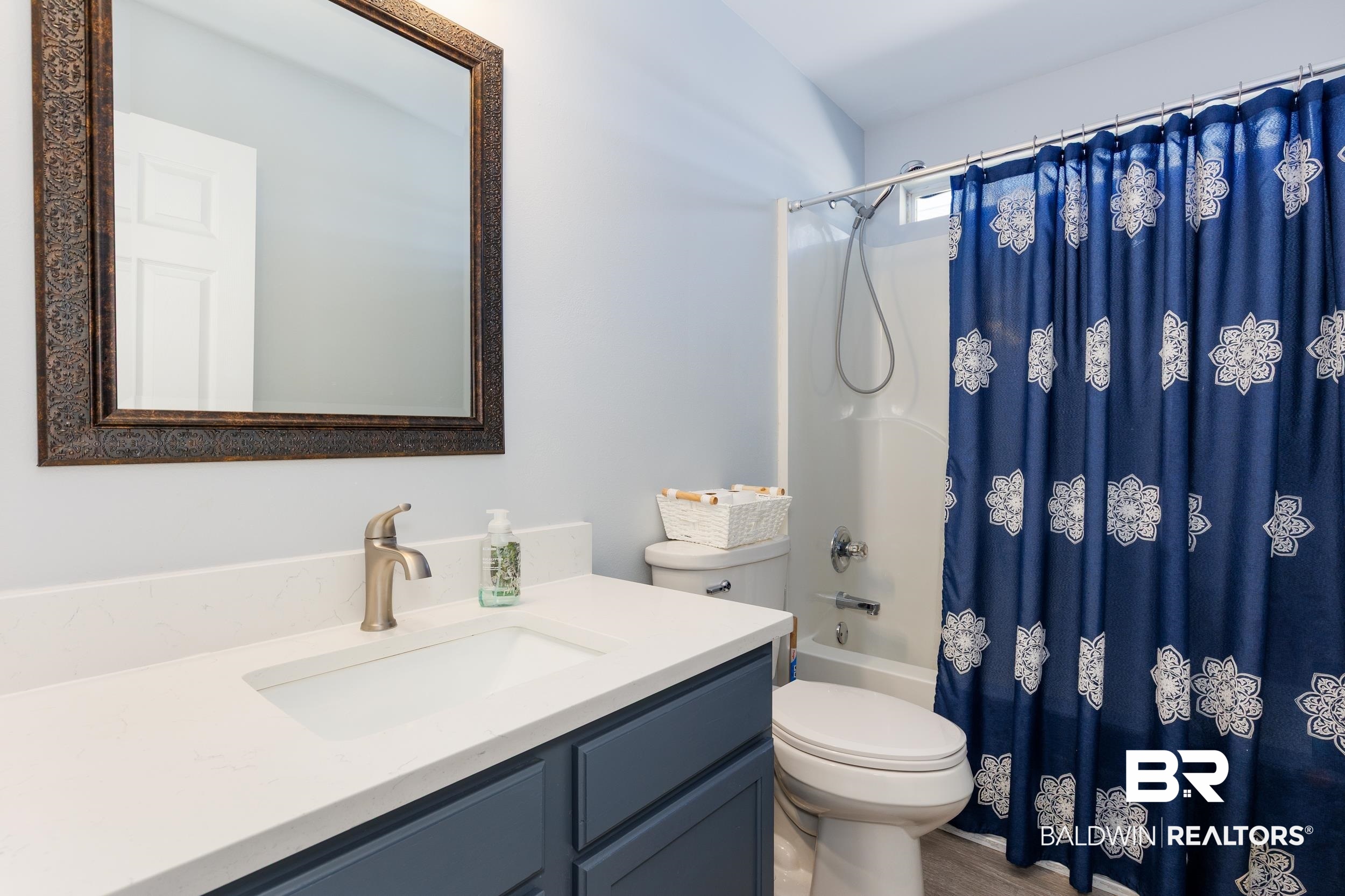 16227 Zenith Drive Loxley, AL 36551 - Photo 17 of 23 Full bath with vanity and shower / bath combination with curtain