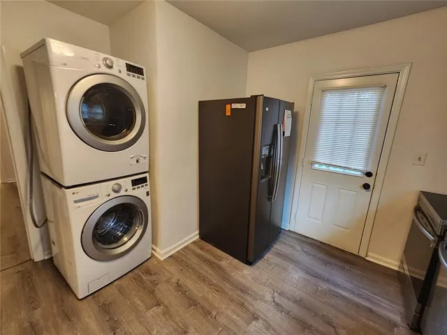 a view of a storage and utility room with washer and dryer
