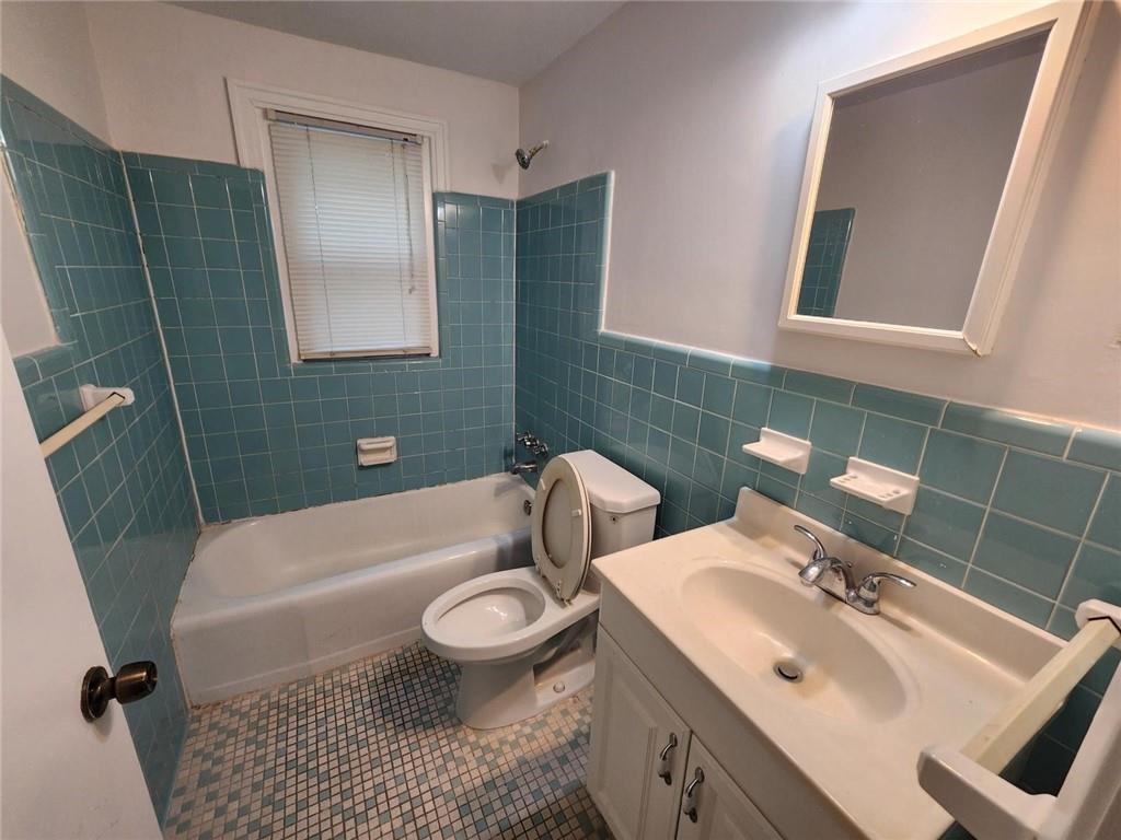 2431 North Decatur Road Decatur, GA 30033 - Photo 27 of 34 a bathroom with a sink a toilet and shower