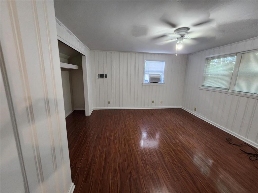 2431 North Decatur Road Decatur, GA 30033 - Photo 32 of 34 an empty room with wooden floor and windows