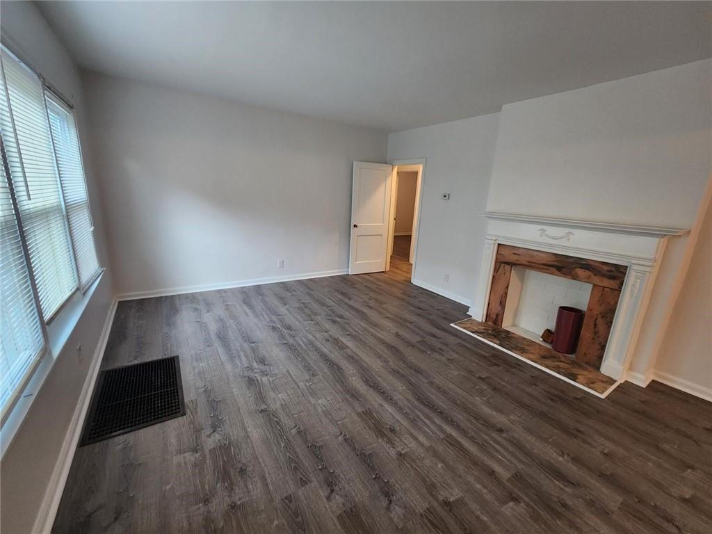 2431 North Decatur Road Decatur, GA 30033 - Photo 10 of 34 wooden floor in an empty room with a window