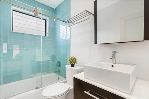 a bathroom with a bathtub and a sink