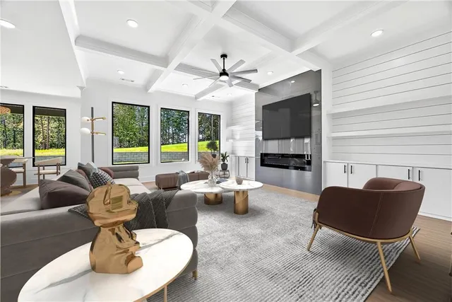 a living room with fireplace furniture and a large window