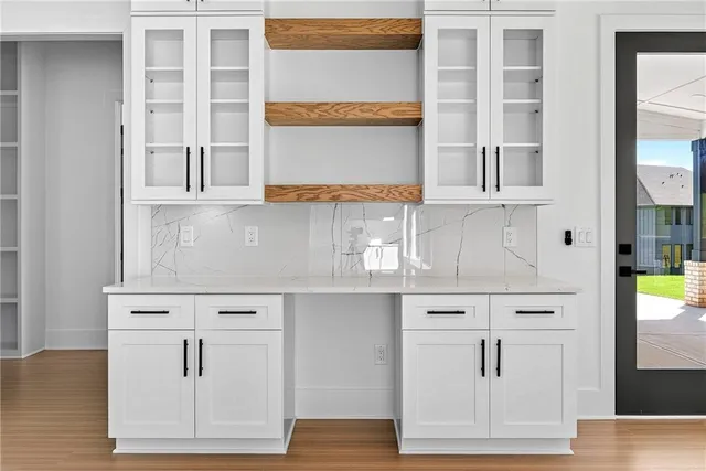 a view of cabinets and window