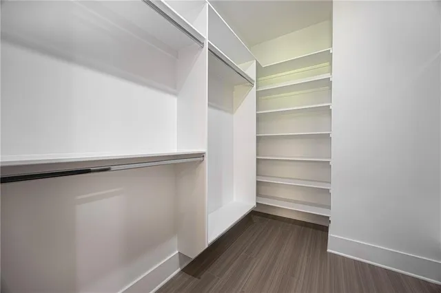a view of an empty walk in closet