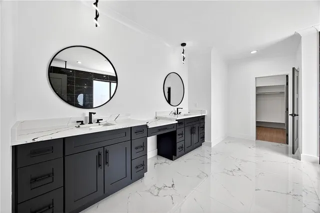 a bathroom with a double vanity sink and a mirror