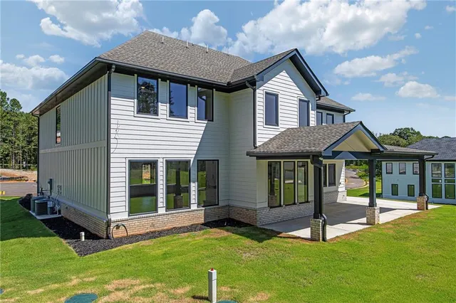 a front view of a house with a yard