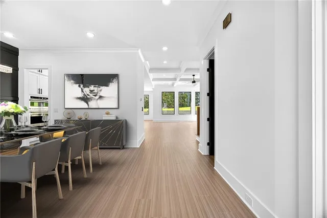 a view of a dining room with furniture and wooden floor