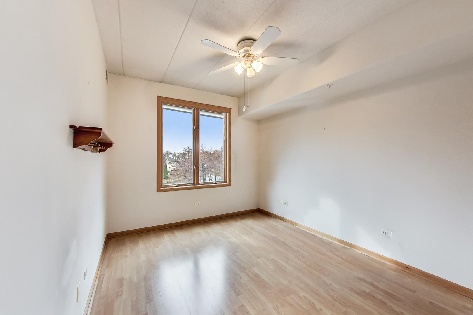 1761 Pavilion Way, Unit 306 Park Ridge, IL 60068 - Photo 11 of 19 wooden floor in an empty room with a window