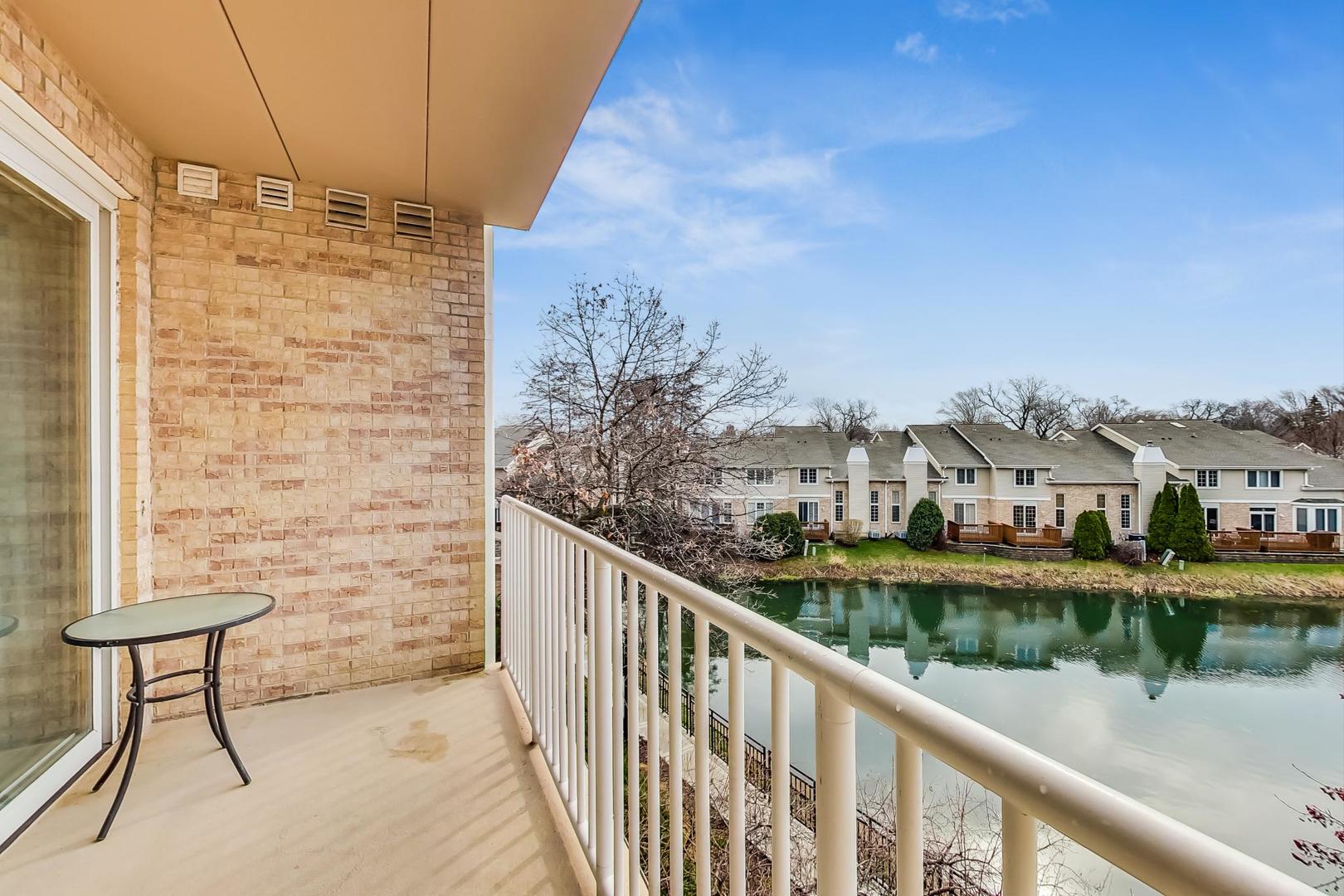 1761 Pavilion Way, Unit 306 Park Ridge, IL 60068 - Photo 14 of 19 a view of a lake from a balcony