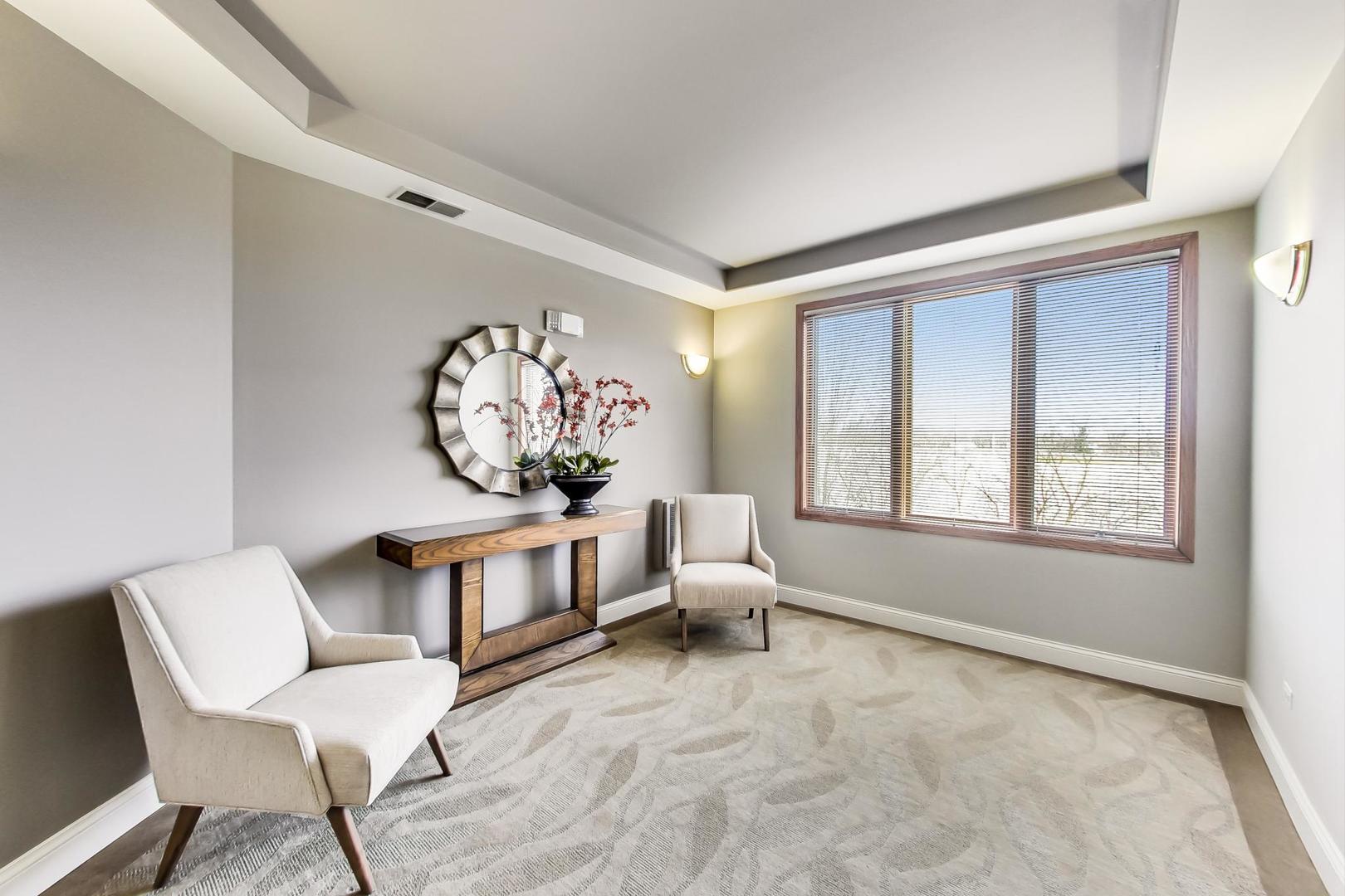 1761 Pavilion Way, Unit 306 Park Ridge, IL 60068 - Photo 2 of 19 a living room with furniture and a large window