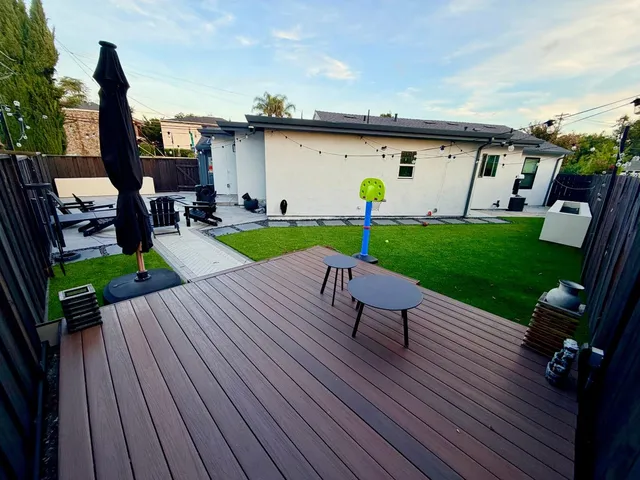 a view of a backyard with sitting area