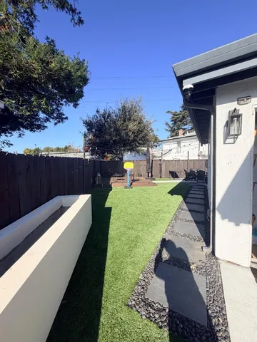 a view of a patio with a yard