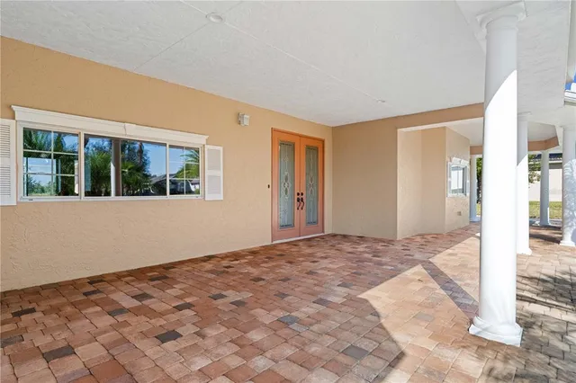 a kitchen with stainless steel appliances granite countertop a sink a stove a refrigerator and island