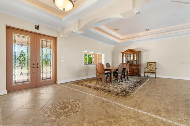 a kitchen with stainless steel appliances granite countertop a sink a stove and a refrigerator