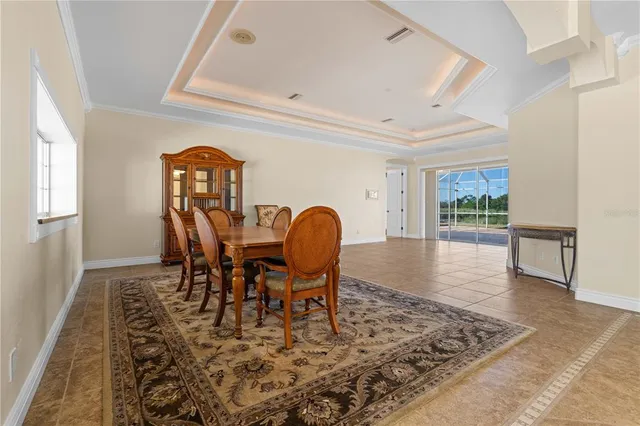 a living room with furniture a ceiling fan and a rug
