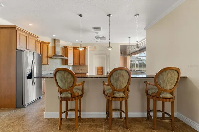 a living room with furniture a flat screen tv and a window