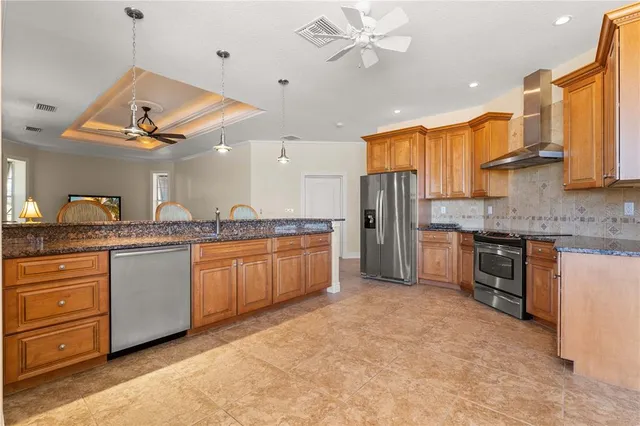 a spacious bathroom with a granite countertop sink a mirror and shower