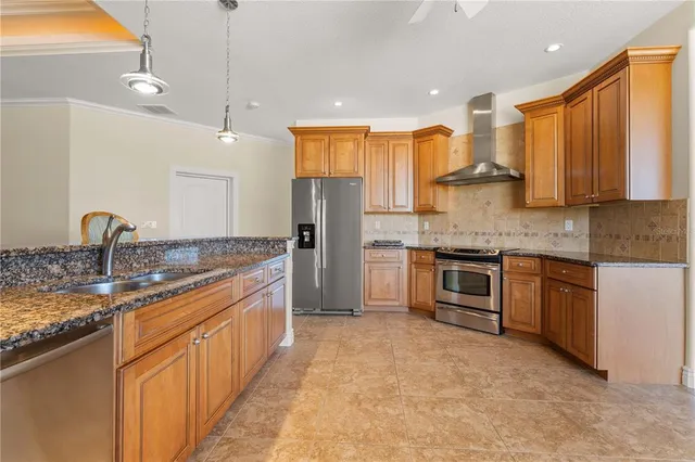 a bathroom with a granite countertop sink a mirror and shower