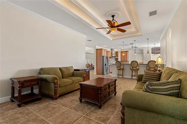 a view of an empty room with closet and a window