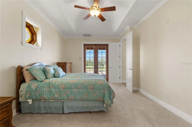 a view of an empty room with cabinet and a window