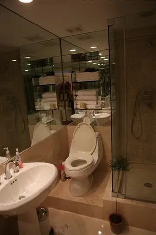 an outdoor space with seating area and trees