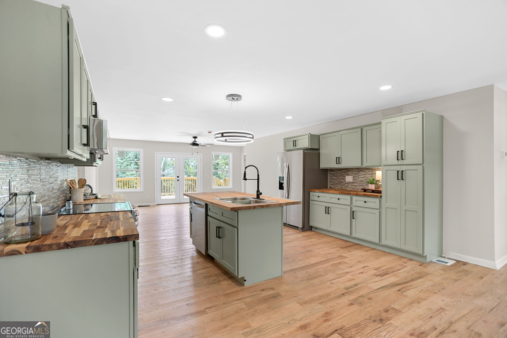 7060 Scenic Heights Road Manchester, GA 31816 - Photo 13 of 52 a kitchen with stainless steel appliances granite countertop a lot of counter top space and cabinets