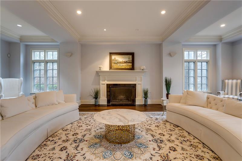 125 Witherow Road Sewickley, PA 15143 - Photo 9 of 25 Another shot of the living room with log burning fireplace and elongated windows.