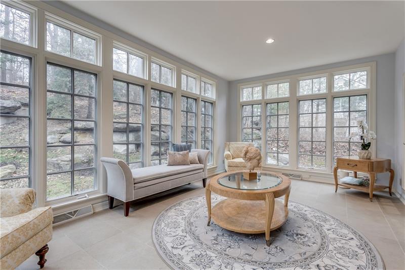 125 Witherow Road Sewickley, PA 15143 - Photo 10 of 25 The Sun room looks out to the woodsie hillside. It could easily be a music room. A baby Grand piano would love this setting.