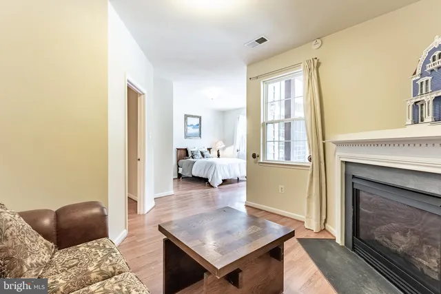 a bedroom with a large bed and a large window