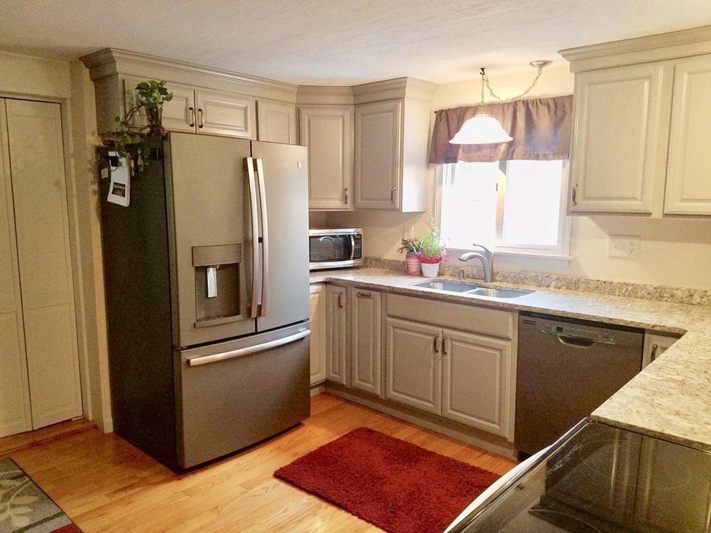 47 Chapin Road Hampden, MA 01036 - Photo 4 of 30 a kitchen with stainless steel appliances granite countertop a refrigerator and a sink
