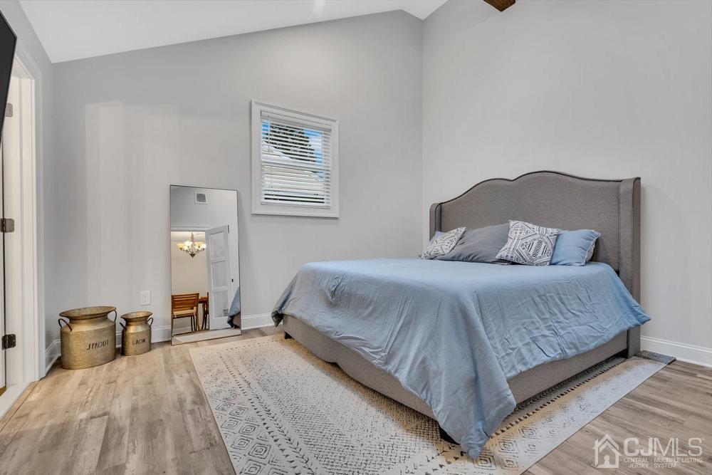 17 Whitney Drive Middlesex, NJ 08846 - Photo 11 of 18 a bedroom with a bed and a night stand