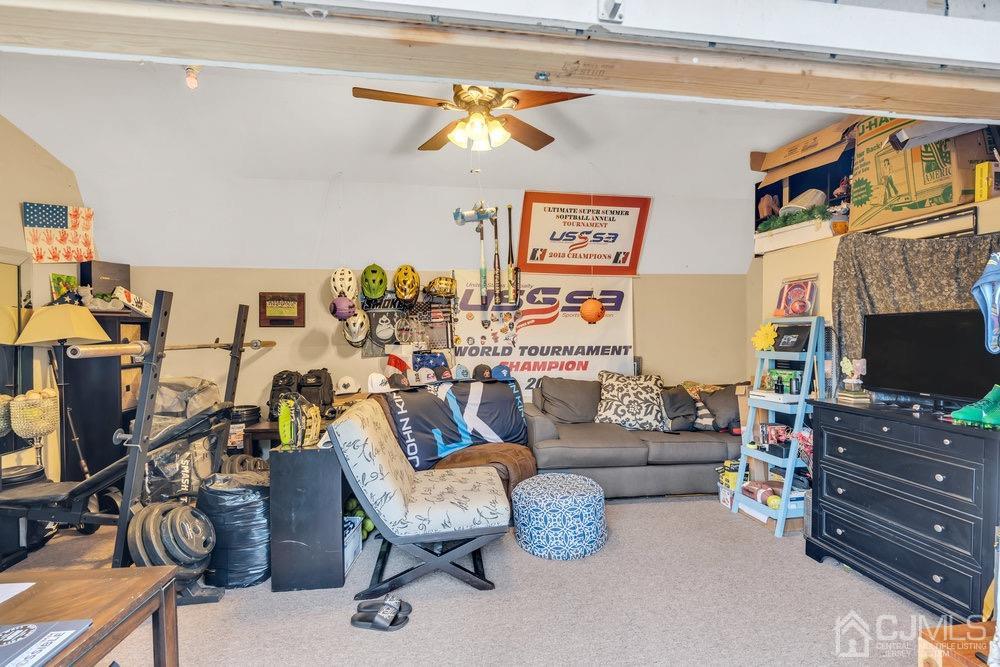 17 Whitney Drive Middlesex, NJ 08846 - Photo 14 of 18 a living room with furniture and a flat screen tv