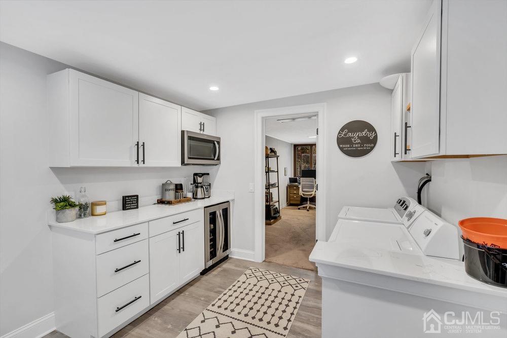 17 Whitney Drive Middlesex, NJ 08846 - Photo 5 of 18 a kitchen with a sink a stove cabinets and a window